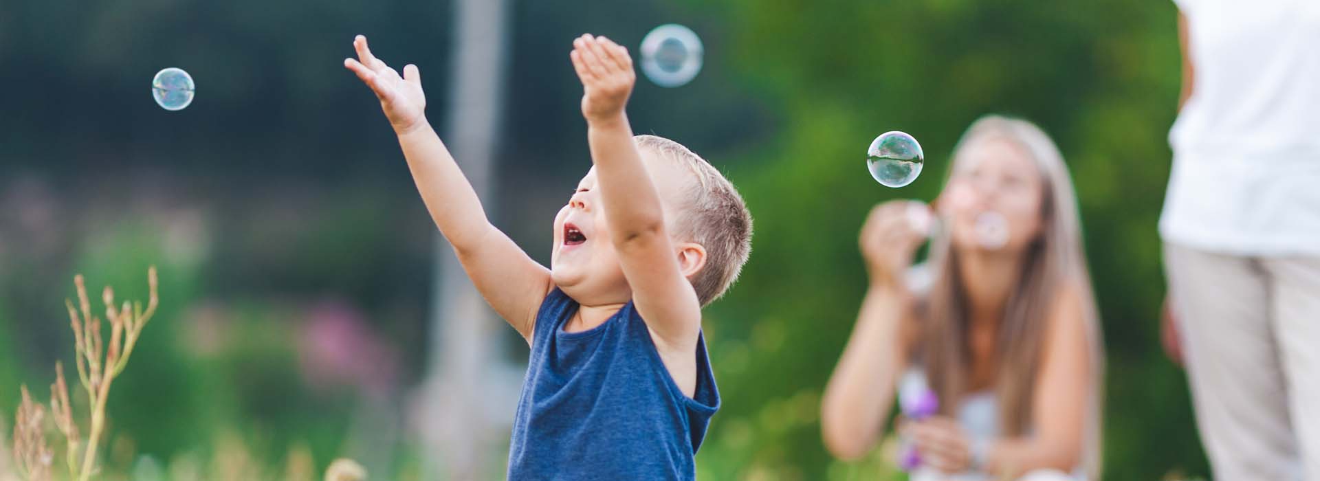 happy kids playing with bubbles
