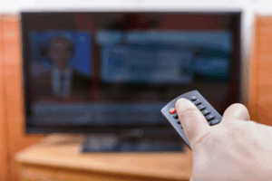 Person turning off the tv.
