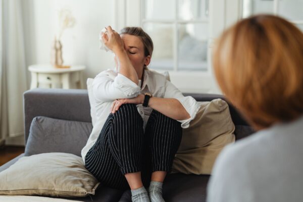 Person feeling overwhelmed during a therapy session, illustrating why therapy may feel like it isn’t working yet.