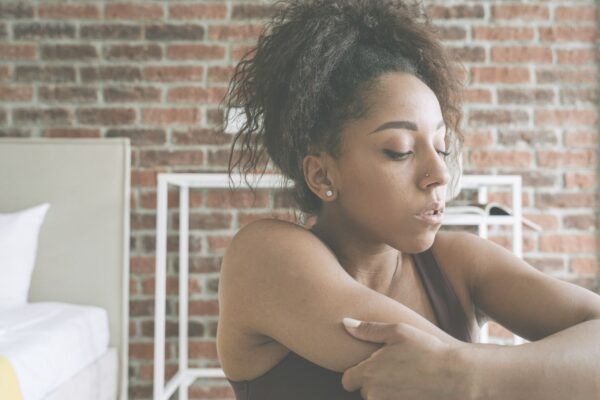 Woman trying to breath because she has a heavy load to carry.