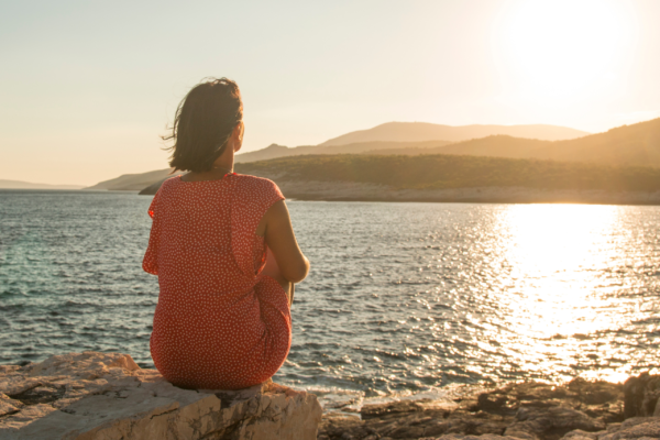 Person reflecting on difficult past experiences and ready to move forward.